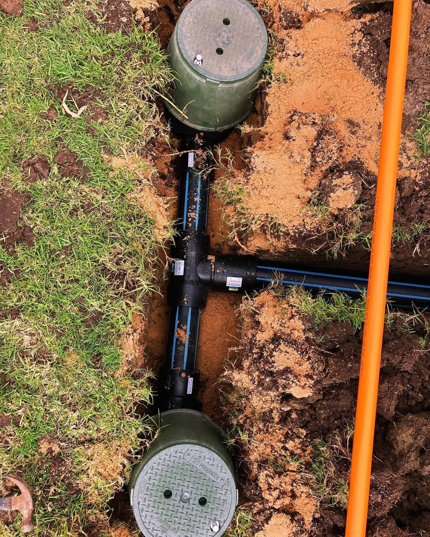 HDPE electrofusion tee connection between two underground valve boxes