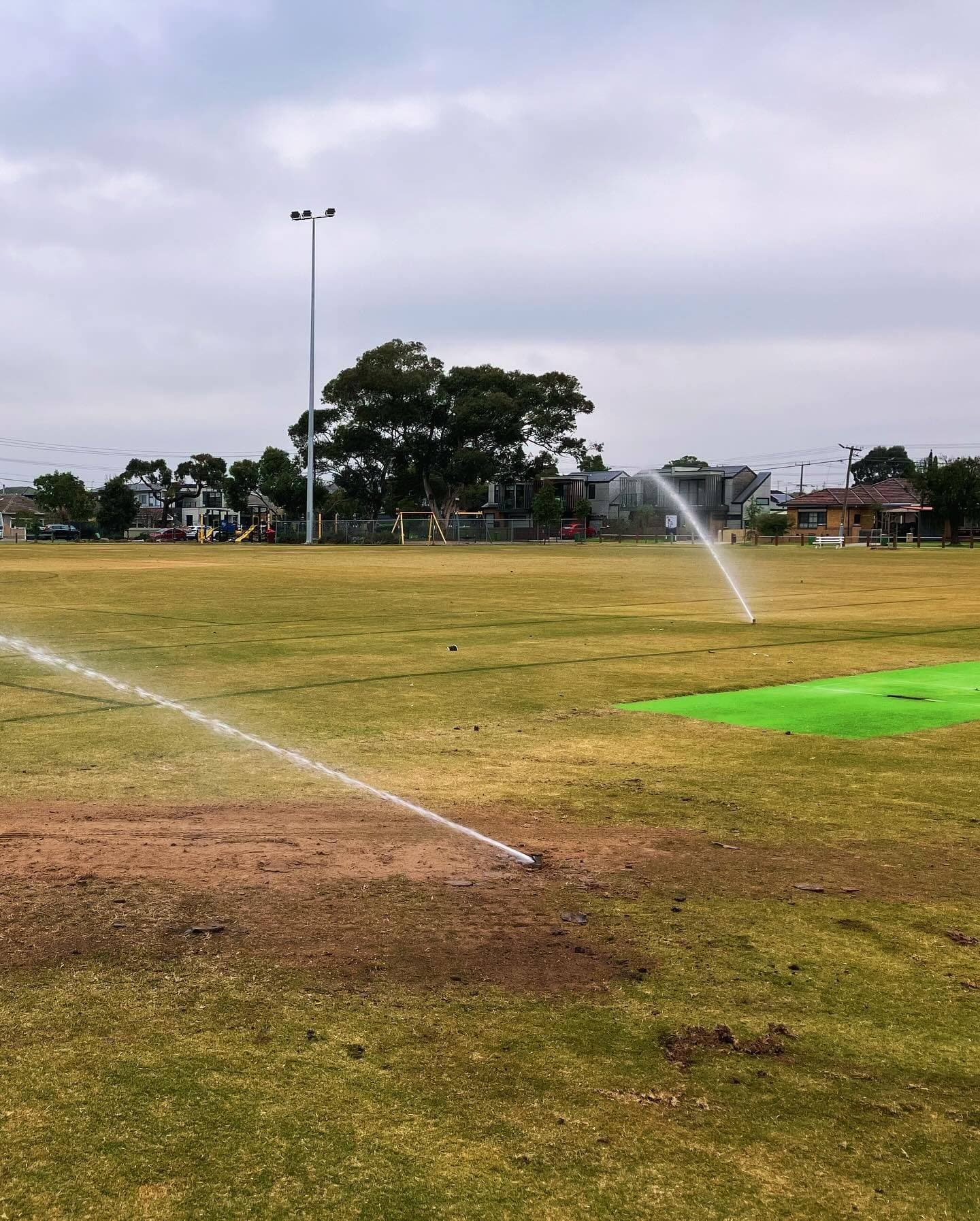Sprinklers running across the oval at Angliss Reserve after the irrigation renewal