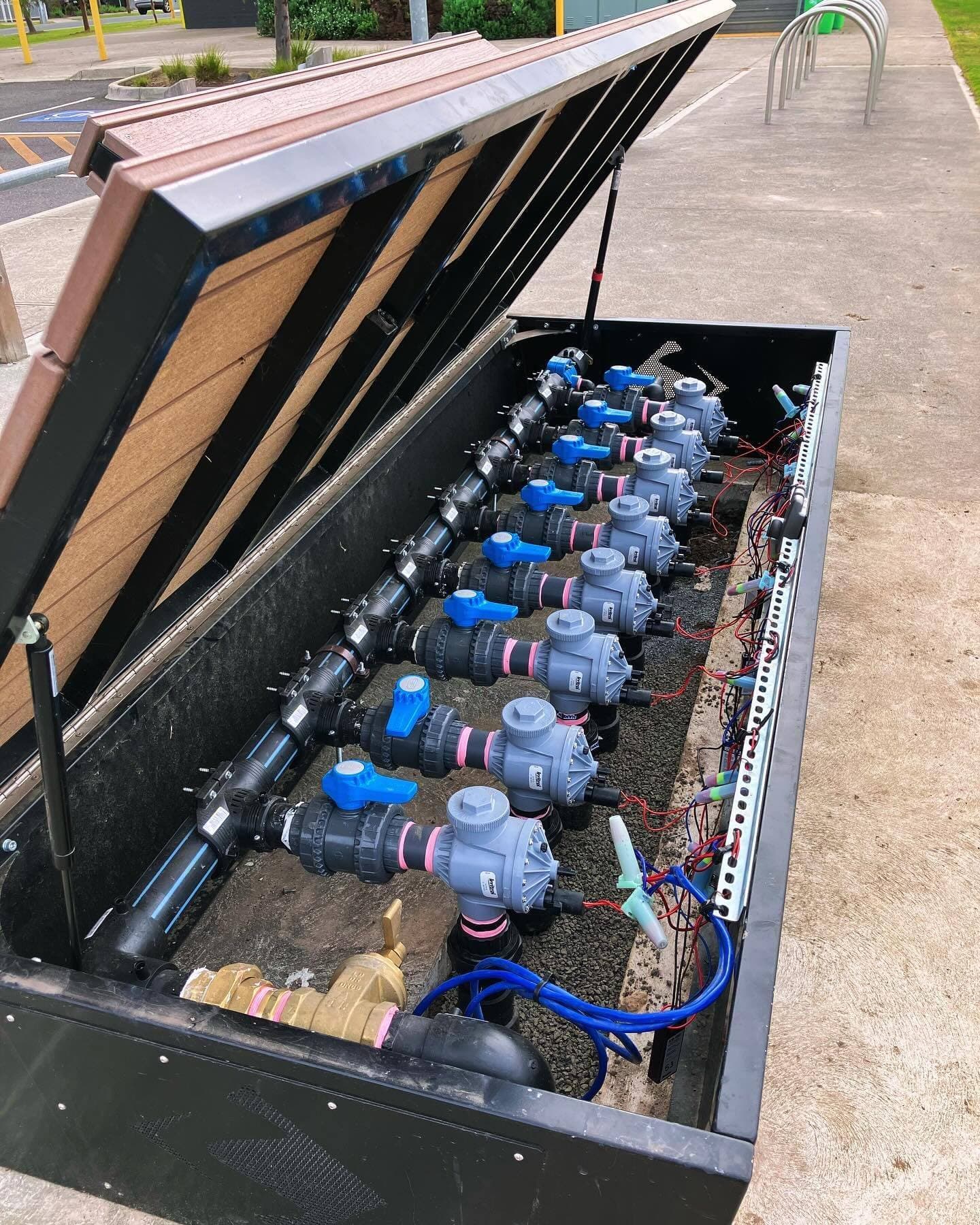 Open bench seat enclosure showing the full solenoid valve manifold and control wiring
