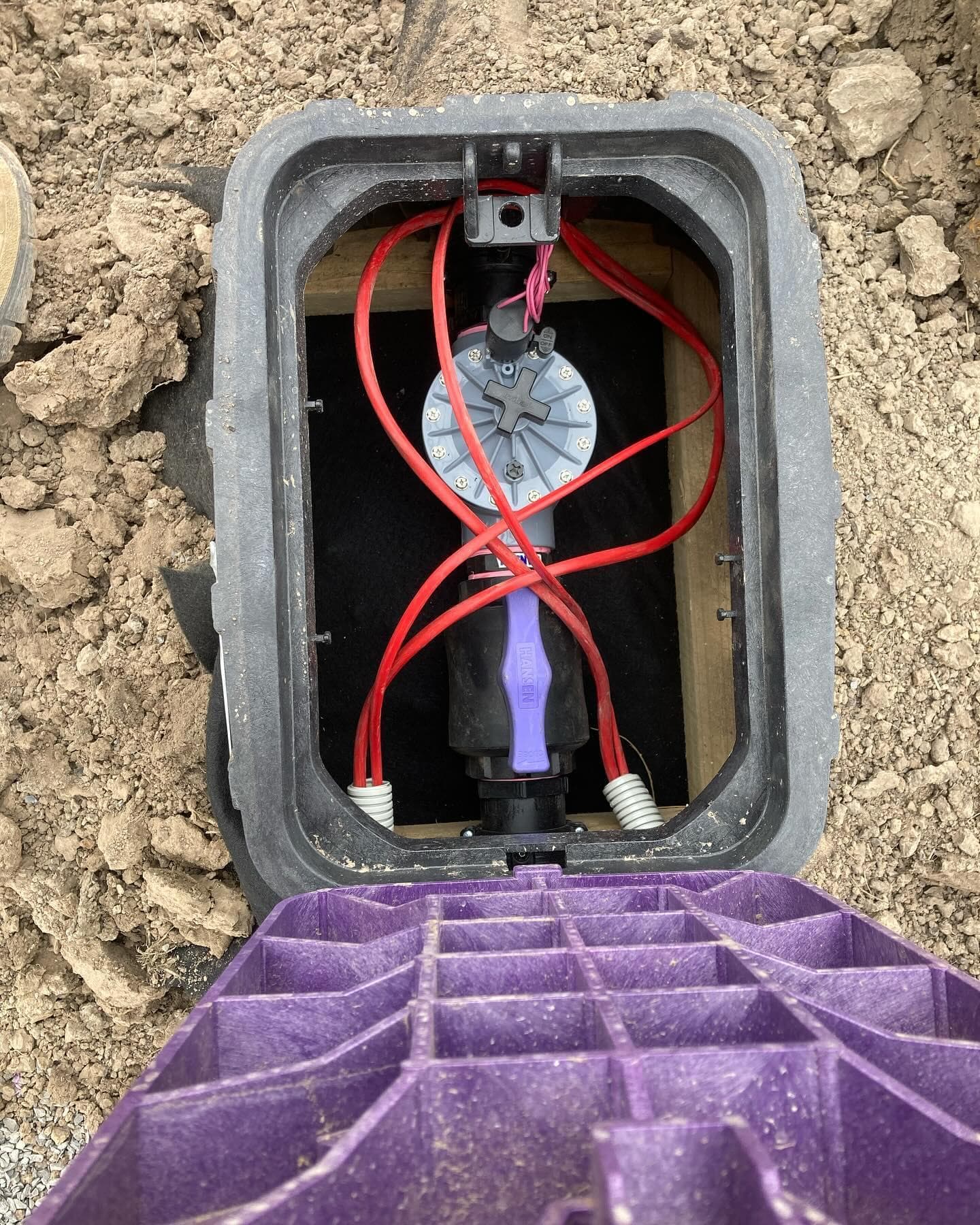 Solenoid valve and isolation assembly within the completed valve box
