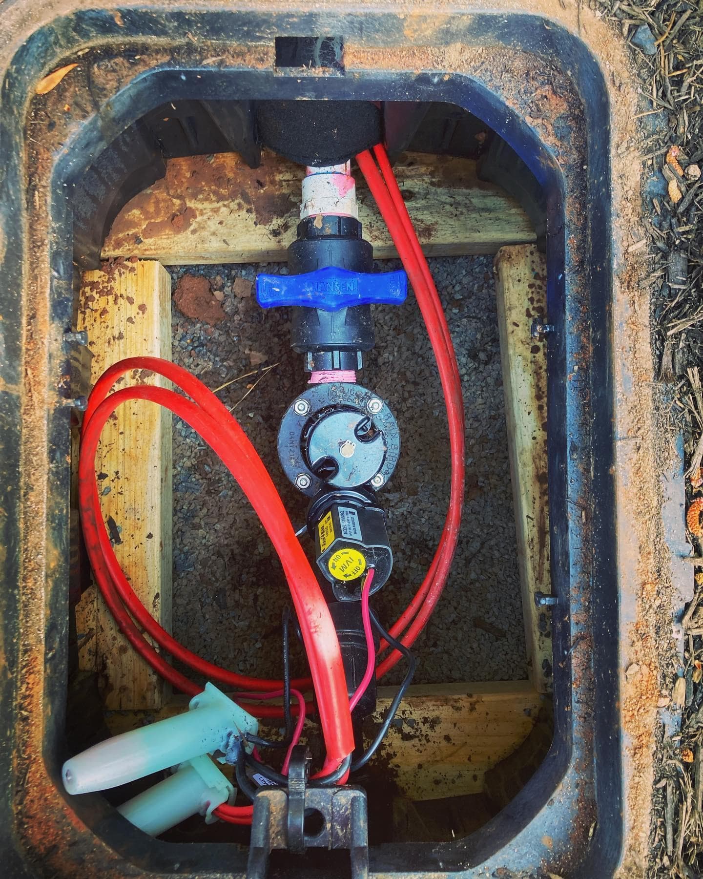 Automatic irrigation valve and isolation assembly within the underground valve box