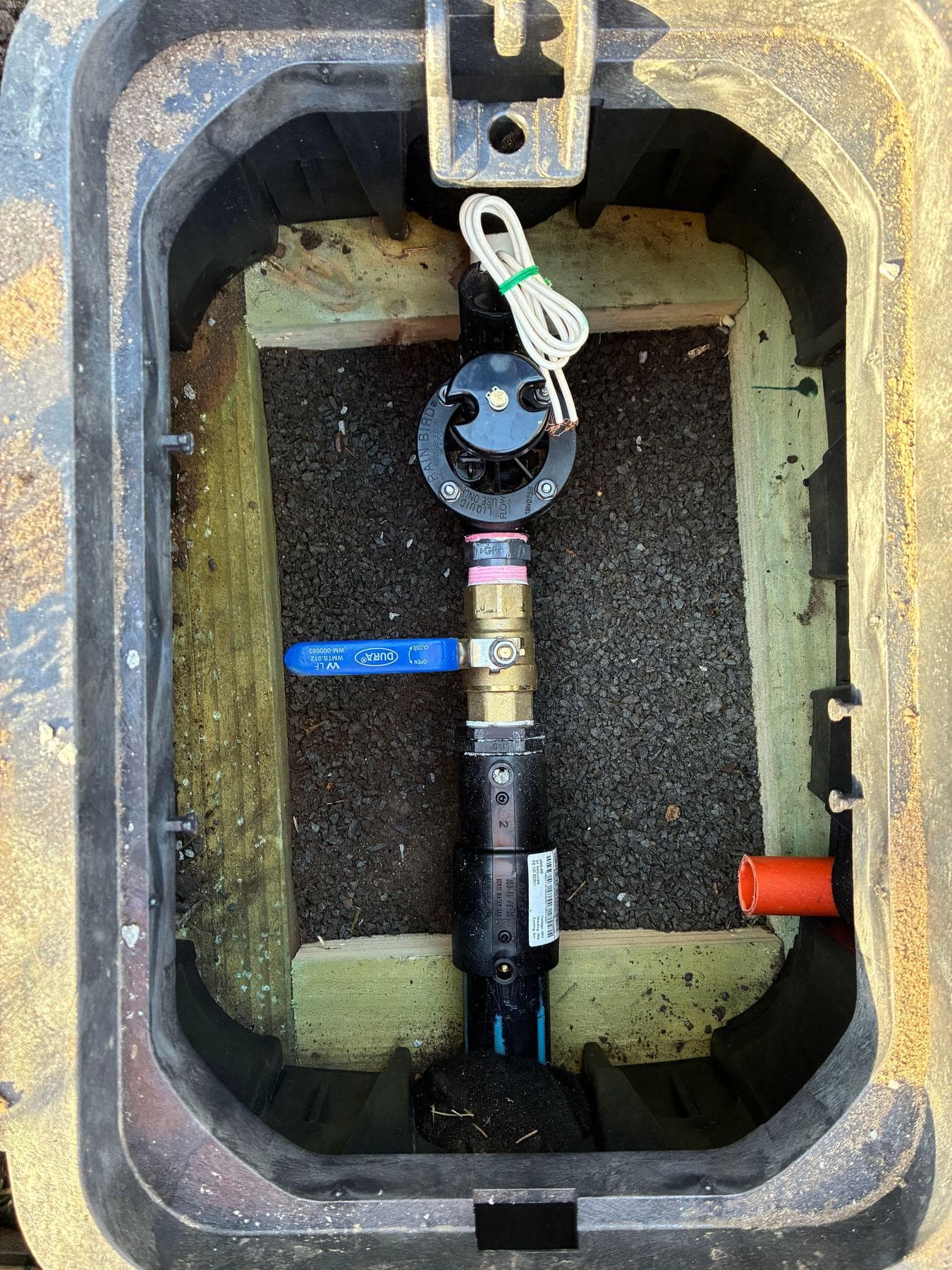 Isolation valve assembly with ball valve and solenoid inside an underground valve box