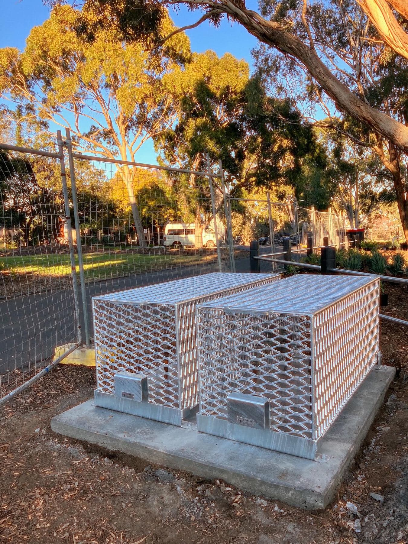 Dual galvanised security cages protecting exposed irrigation service infrastructure